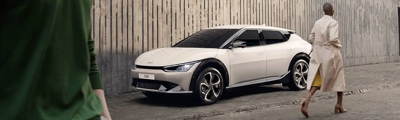 Person walking past Kia EV6
