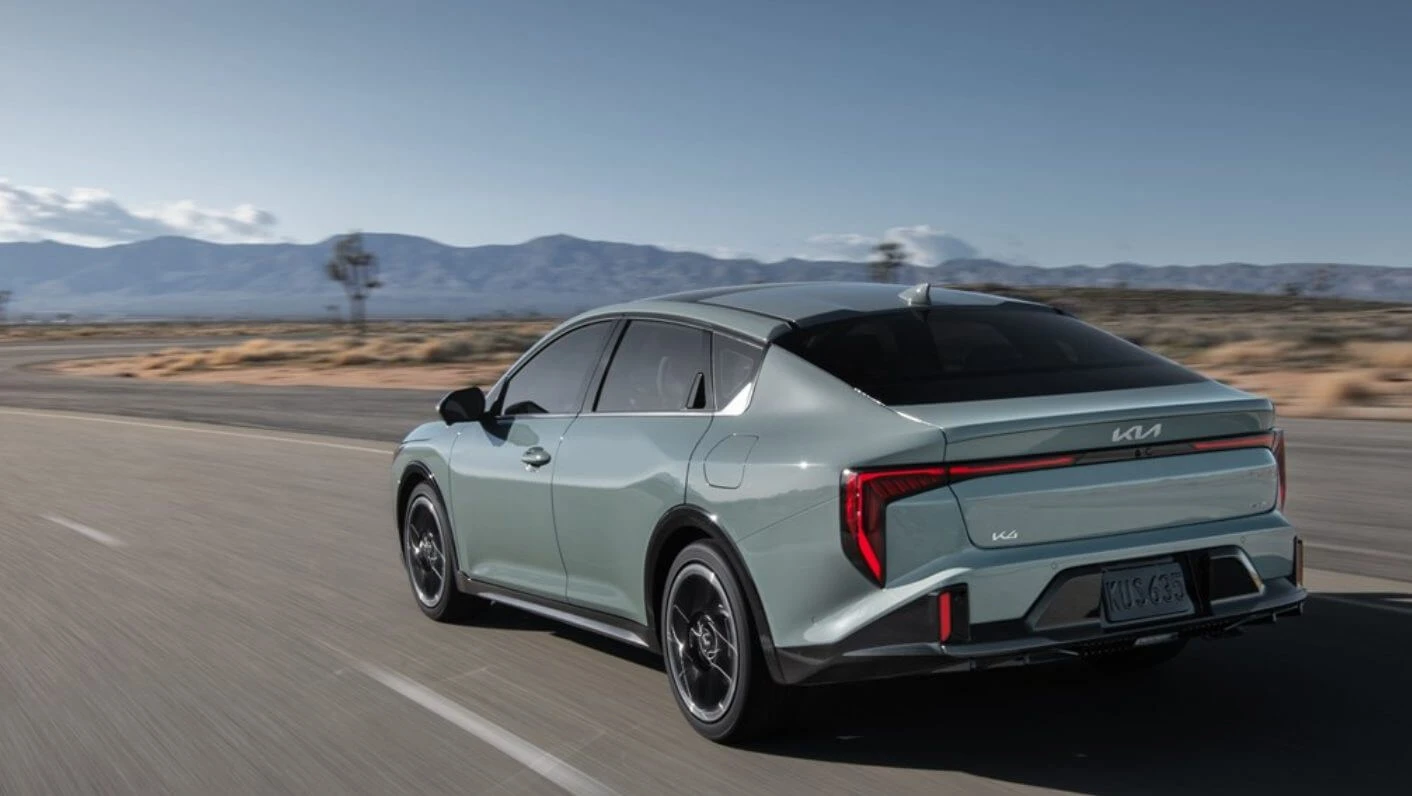 Kia K4 showcasing fuel-efficient drive on a highway