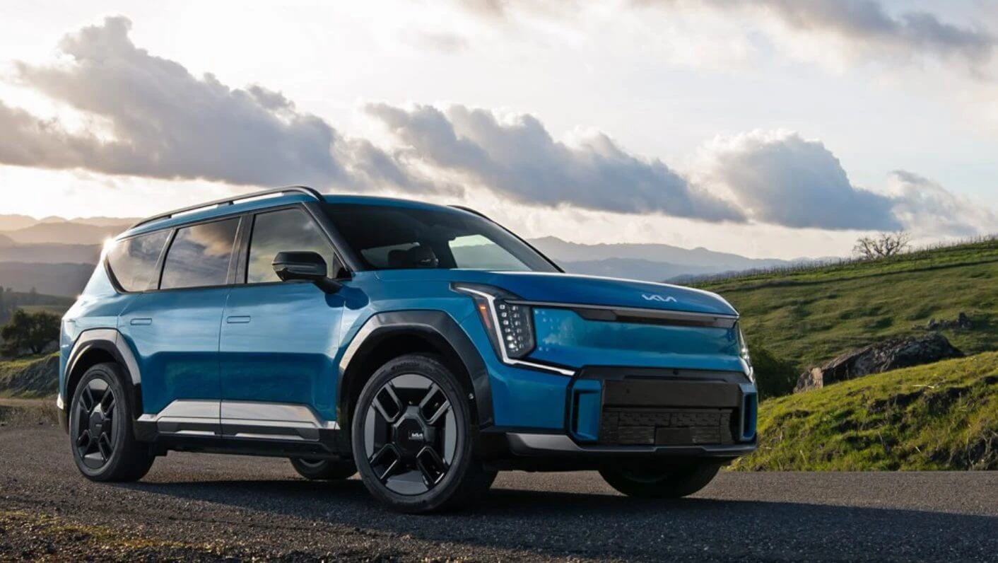 Front view of the 2025 Kia EV9, showcasing its sleek design and LED headlights.