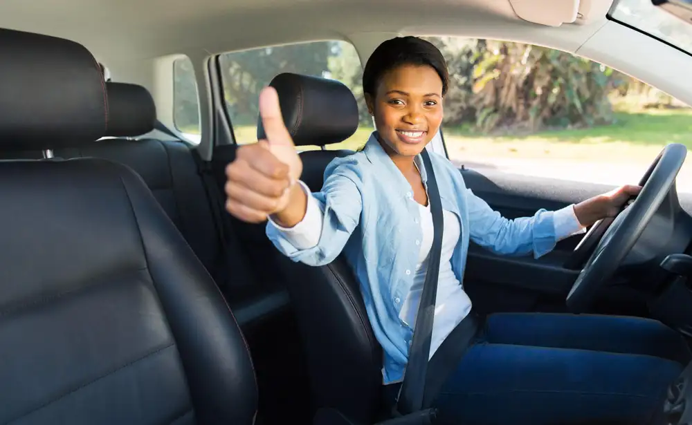 Kia driver in the driver seat of a GPS Tracked Fleet Vehicle