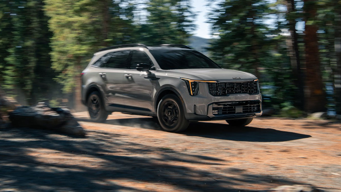 Sorento X-Pro driving off-road with all-wheel drive (AWD) and Drive Mode Select.