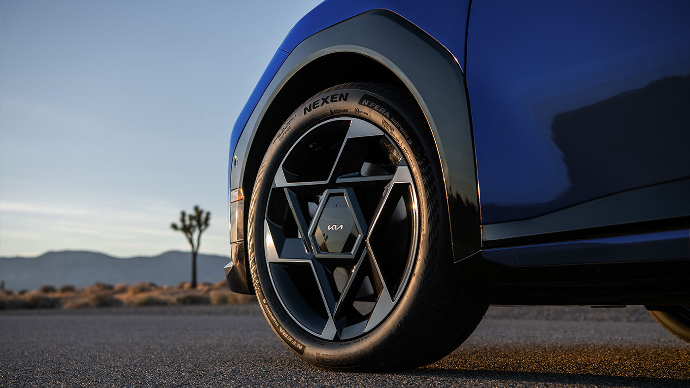 Blue Kia EV4 electric sedan tires