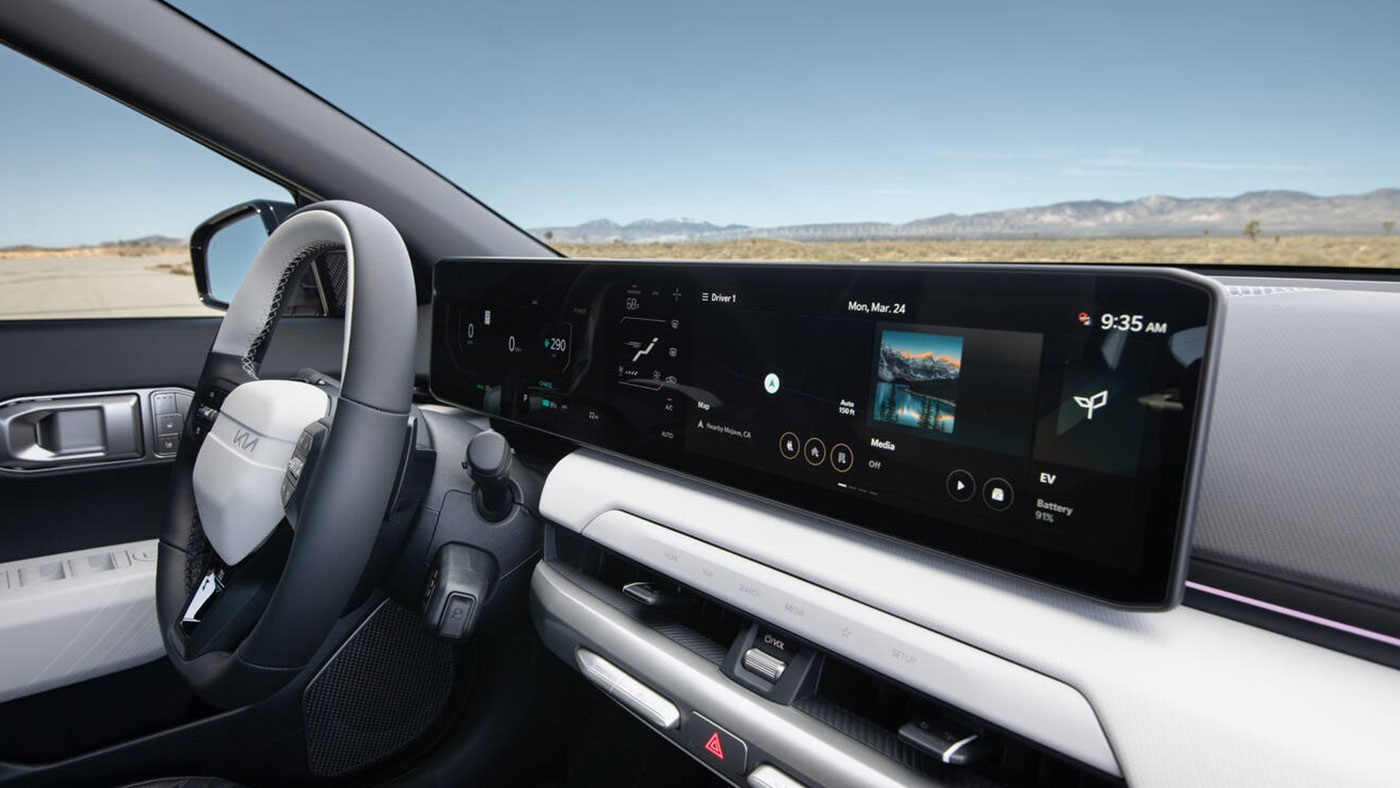 Kia EV4 electric sedan interior dashboard with wireless Android Auto & Apple CarPlay