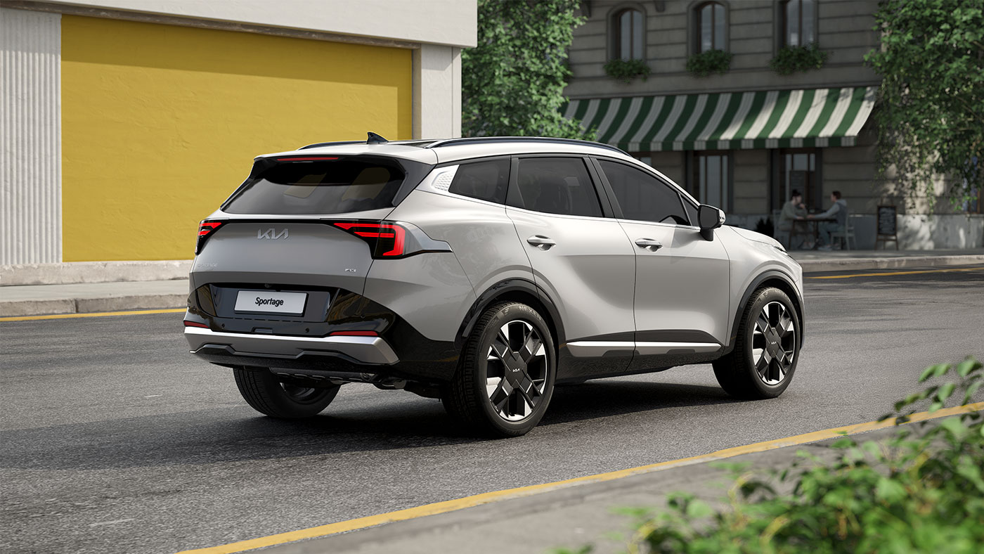 Kia Sportage VUS compact blanc, vue extérieure arrière sur la route