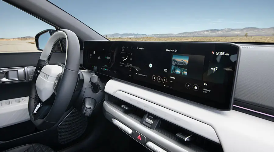 Kia EV4 electric sedan interior dashboard with wireless Android Auto & Apple CarPlay