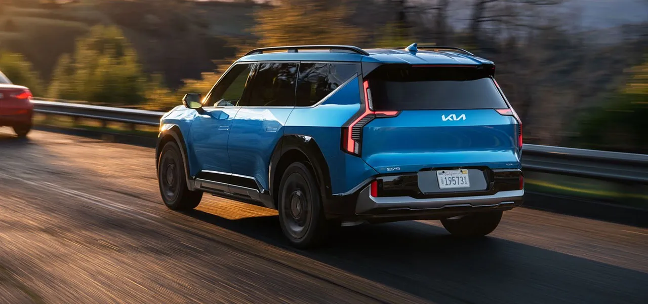 Kia EV9 Land AWD with GT-Line in Ocean Blue charging battery with fast charging capabilities.